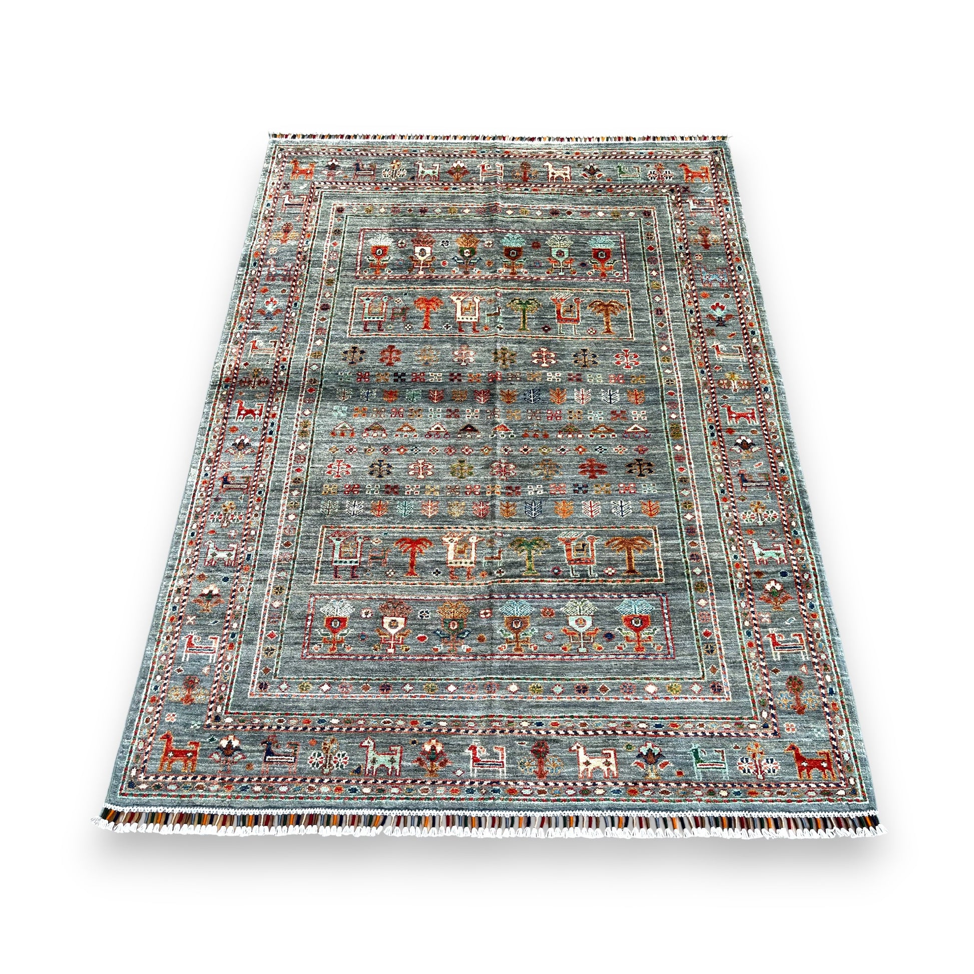 Close-up detail of Afghan hand-knotted wool rug showing intricate tribal motifs and natural wool texture