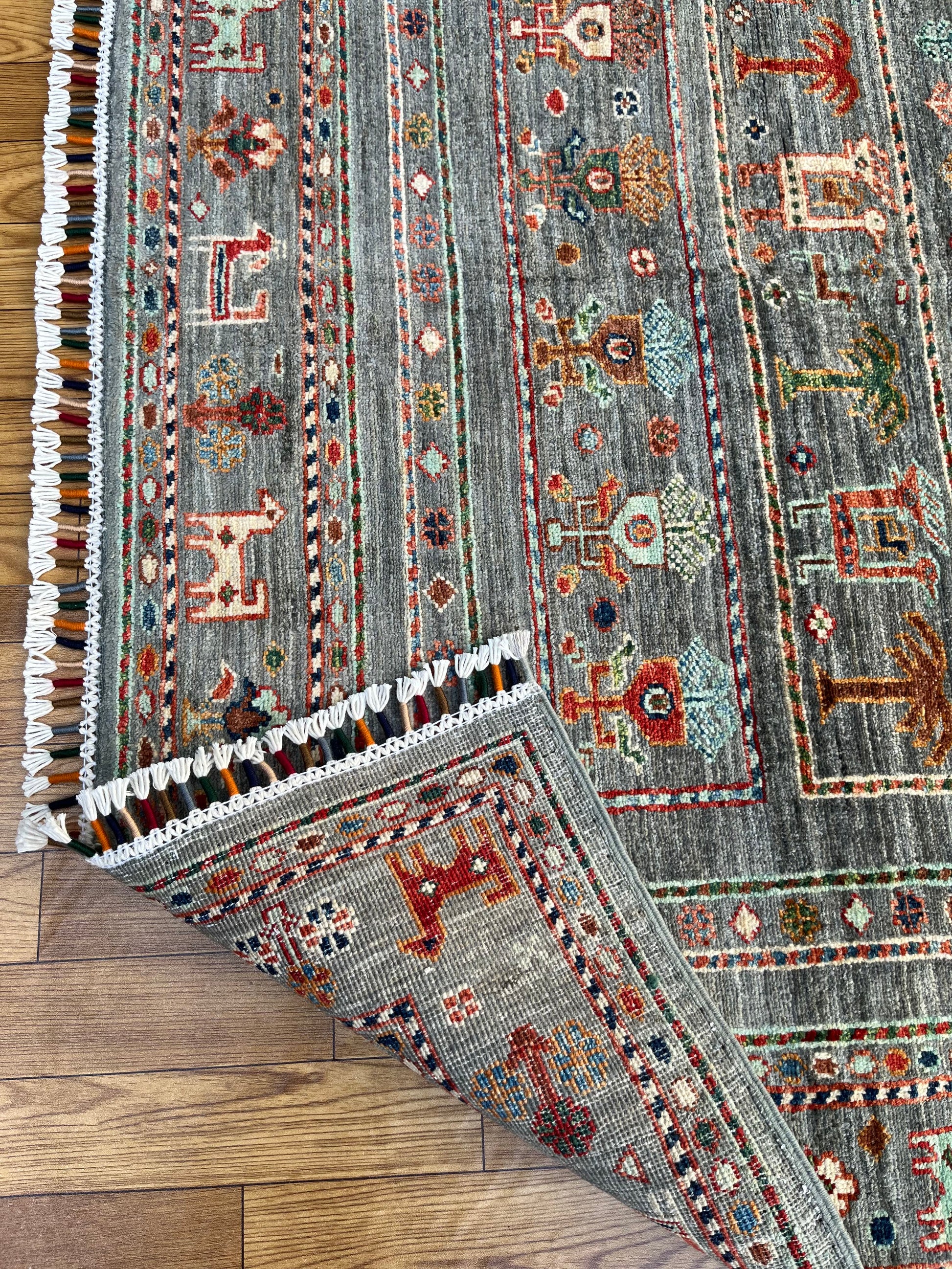 Blue grey Afghan hand-knotted wool area rug with traditional tribal patterns and intricate border design