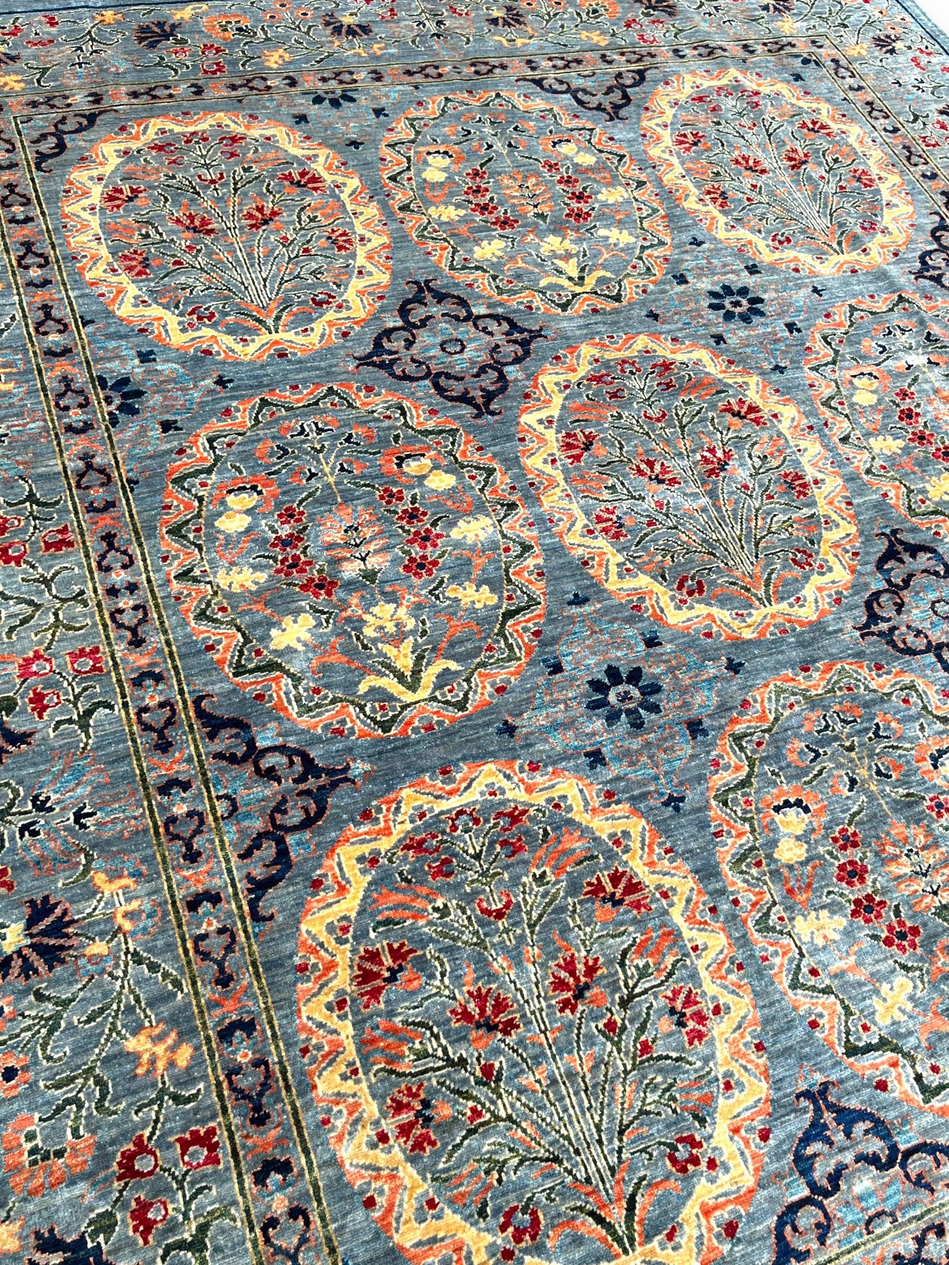 Detailed view of ornament rug border featuring traditional Afghan palmettes and botanical patterns