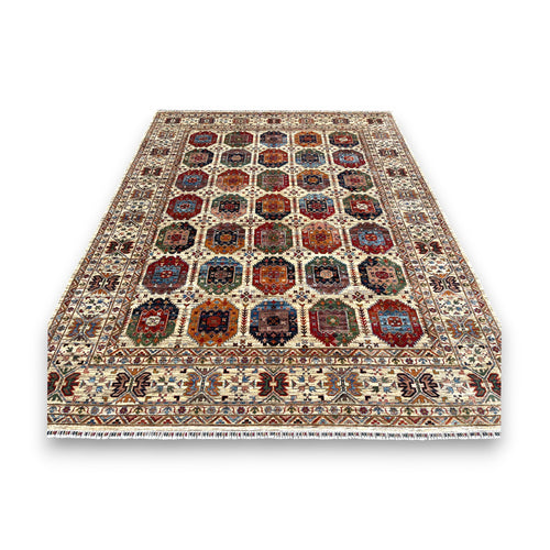 Afghan gallery rug with geometric compartments containing colorful motifs on cream background