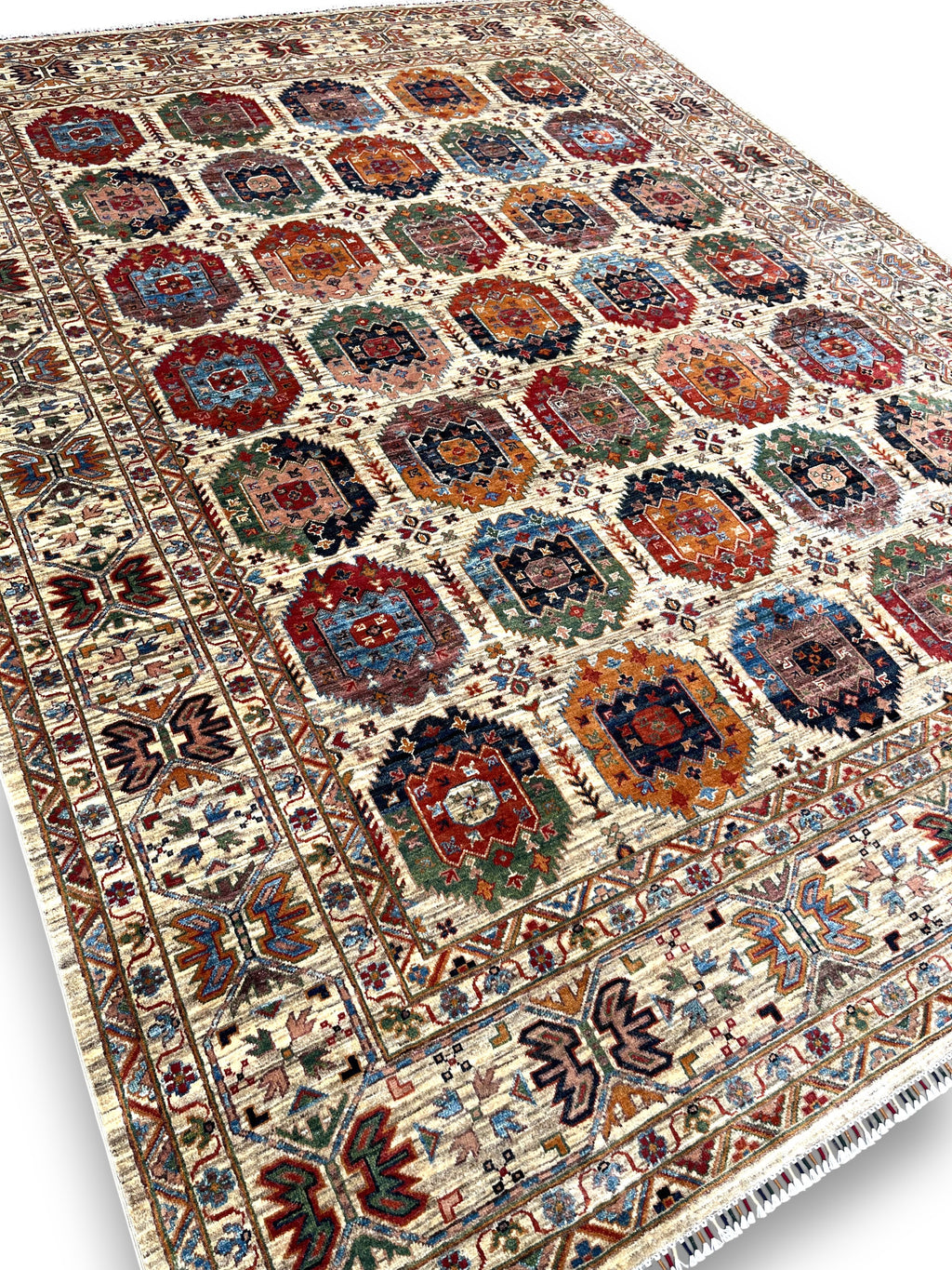 Detailed view of gallery rug border featuring traditional Afghan palmettes and botanical patterns