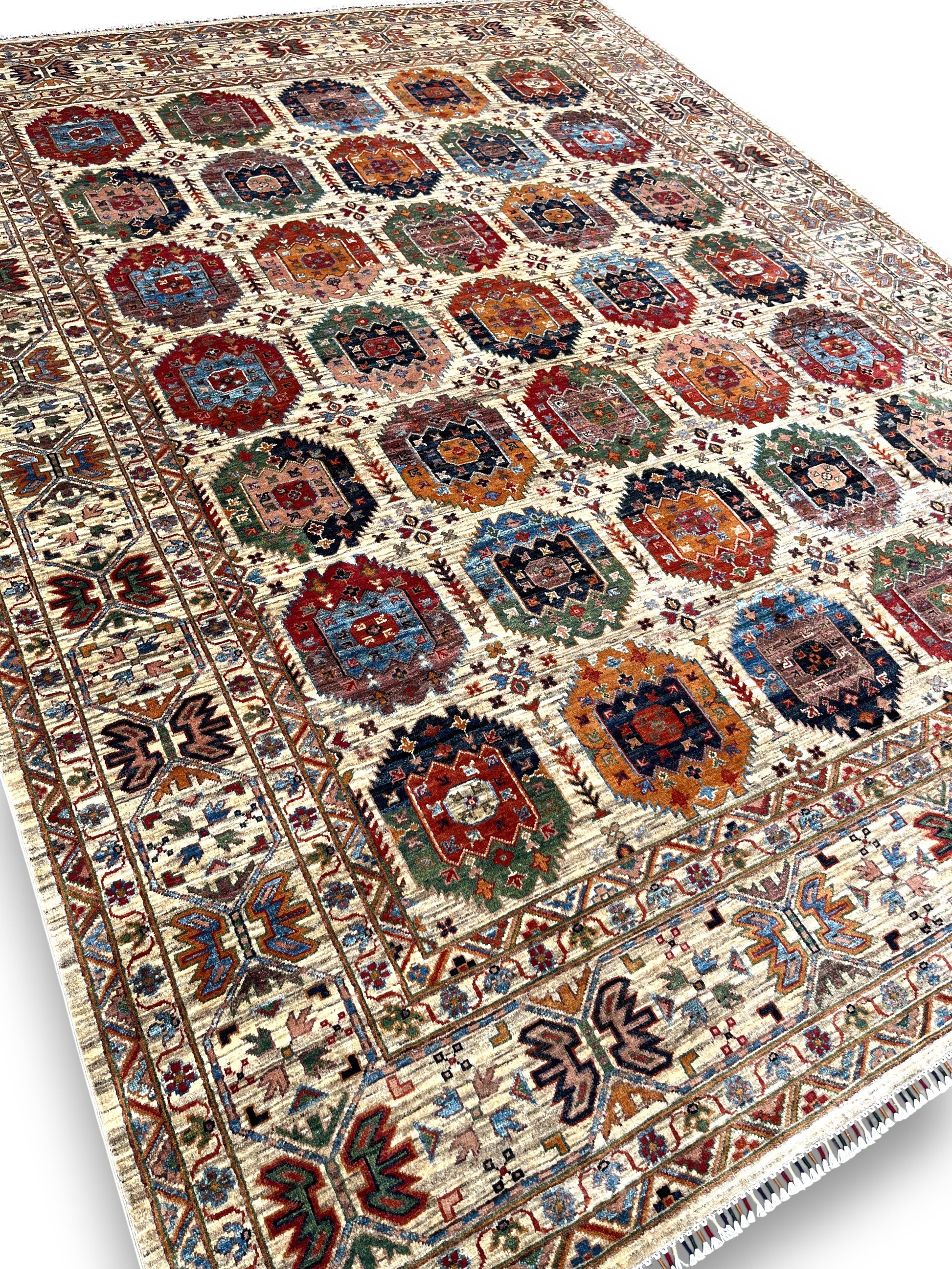 Detailed view of gallery rug border featuring traditional Afghan palmettes and botanical patterns