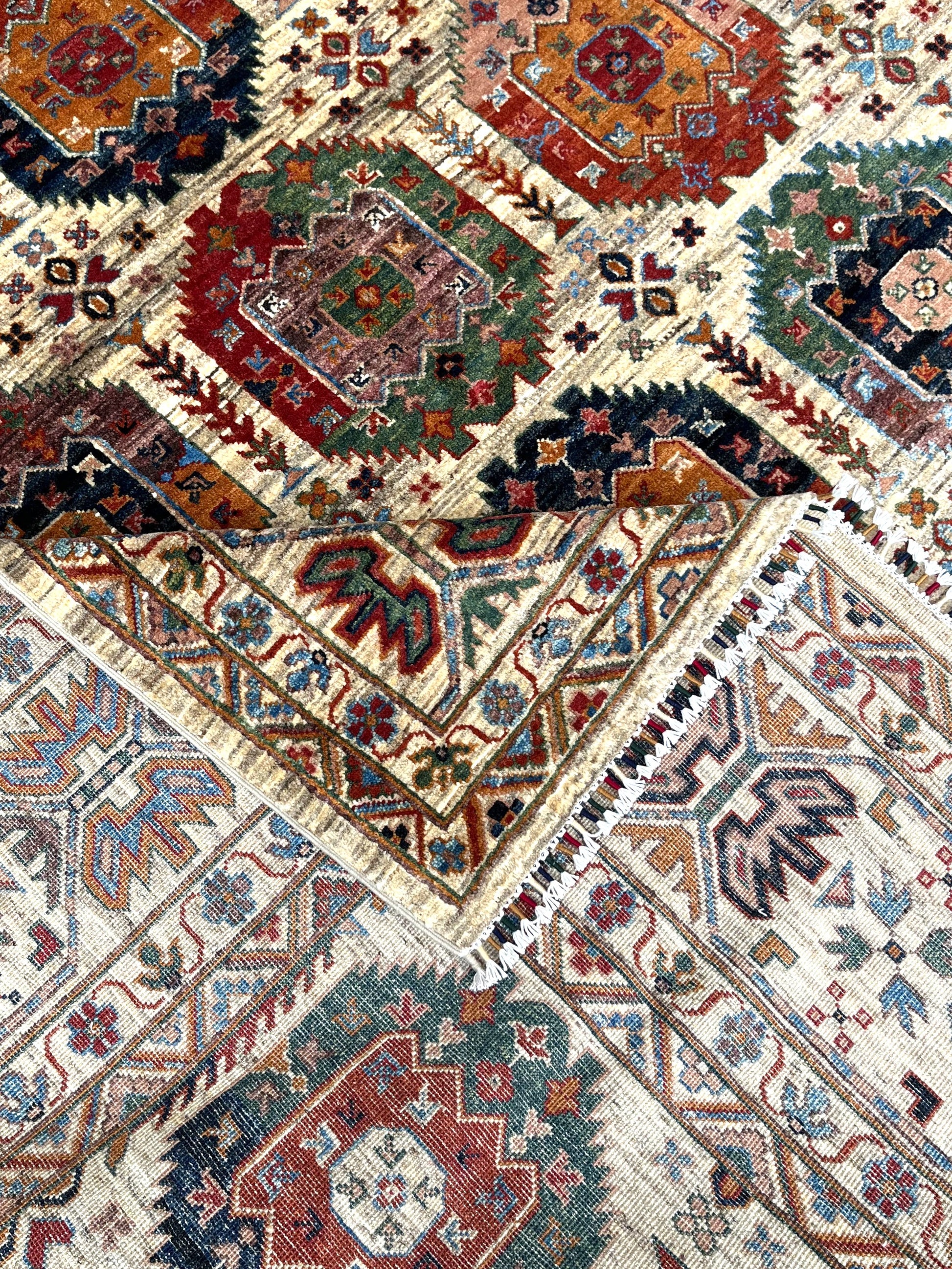 Corner detail of gallery rug showing intricate geometric compartments and connecting lattice work