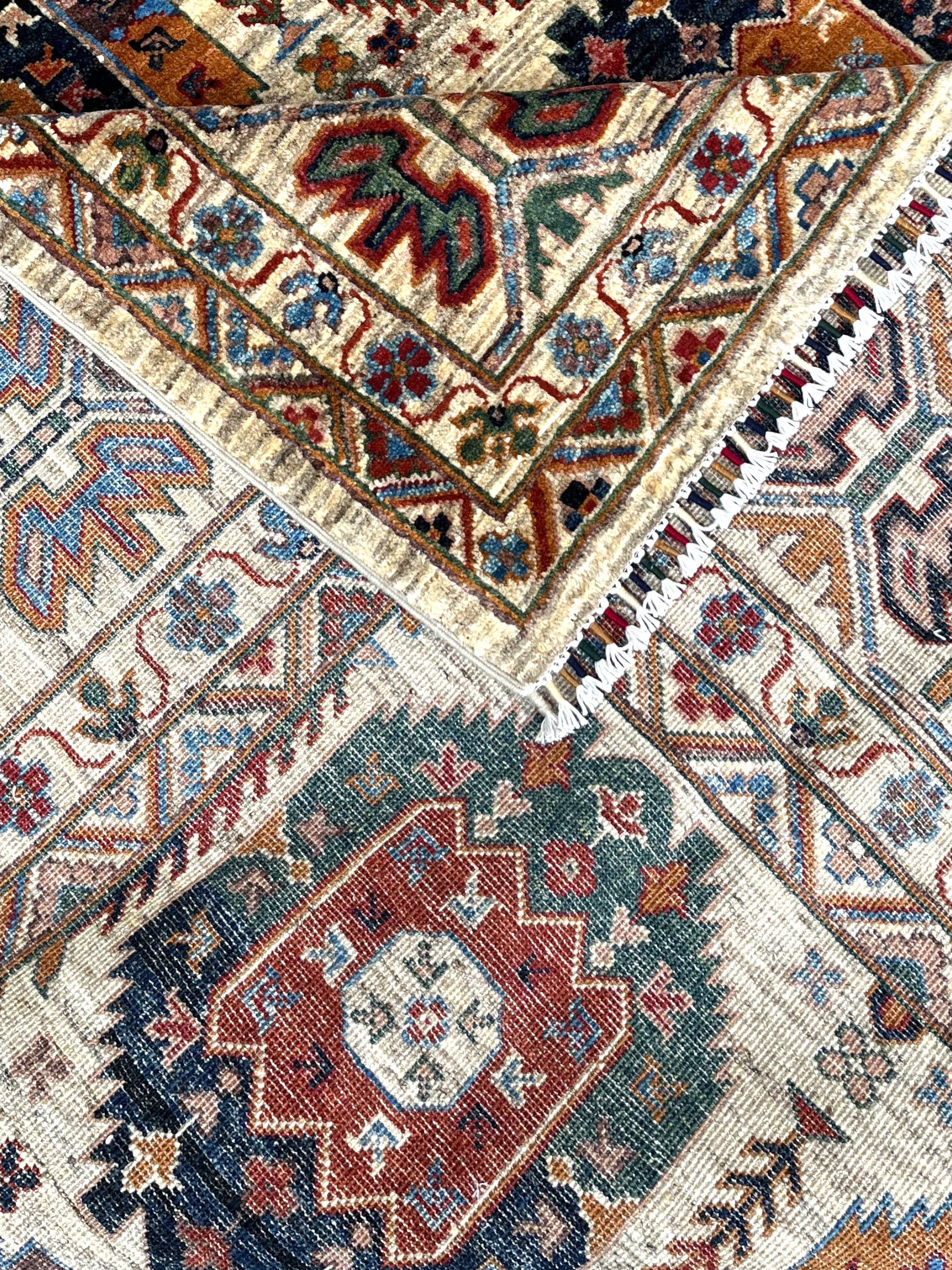 Corner detail of gallery rug showing intricate geometric compartments and connecting lattice work