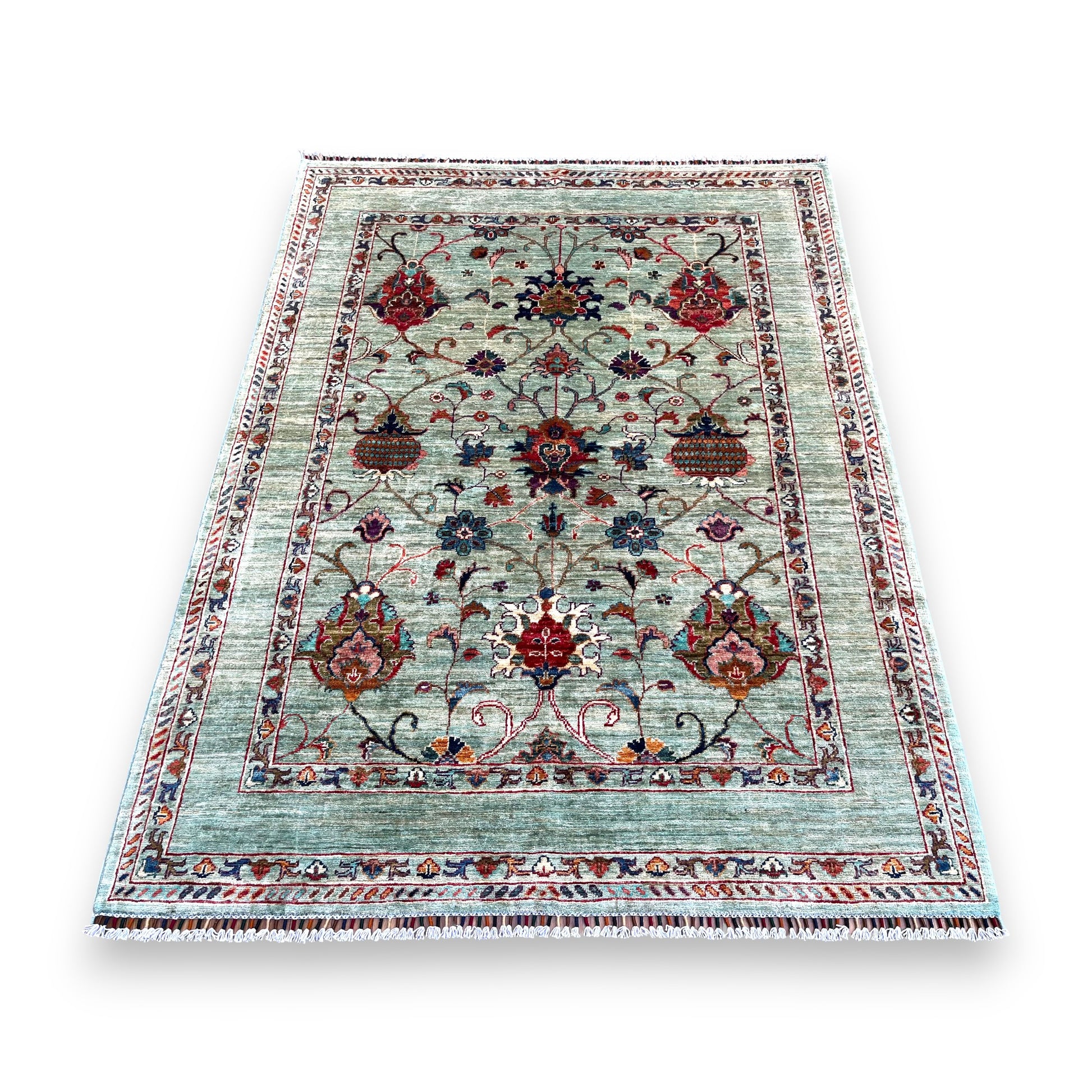 Traditional Afghan hand-knotted rug with sage green field featuring burgundy and coral floral medallions, intricate vine patterns, and decorative borders in earth tones