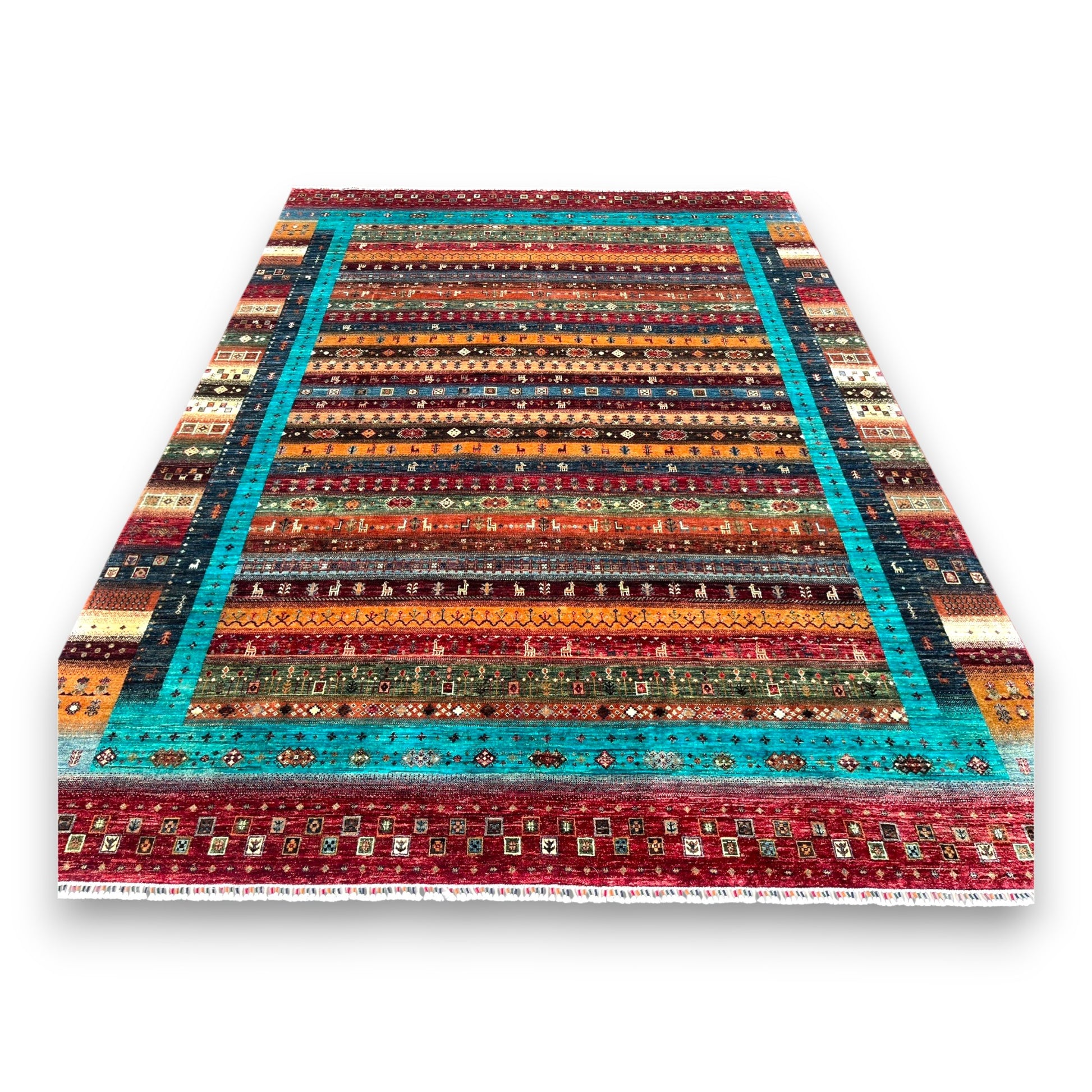 Afghan prism rug with vibrant turquoise border and multicolored striped bands on white background