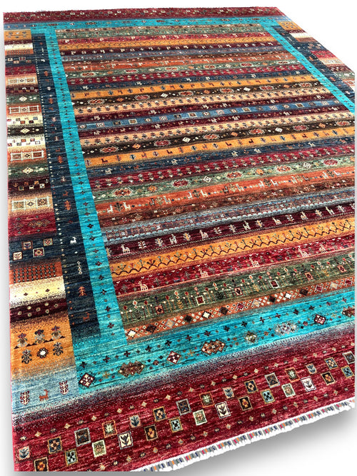 Close-up detail of prism rug showing geometric patterns and traditional motifs in colorful striped bands