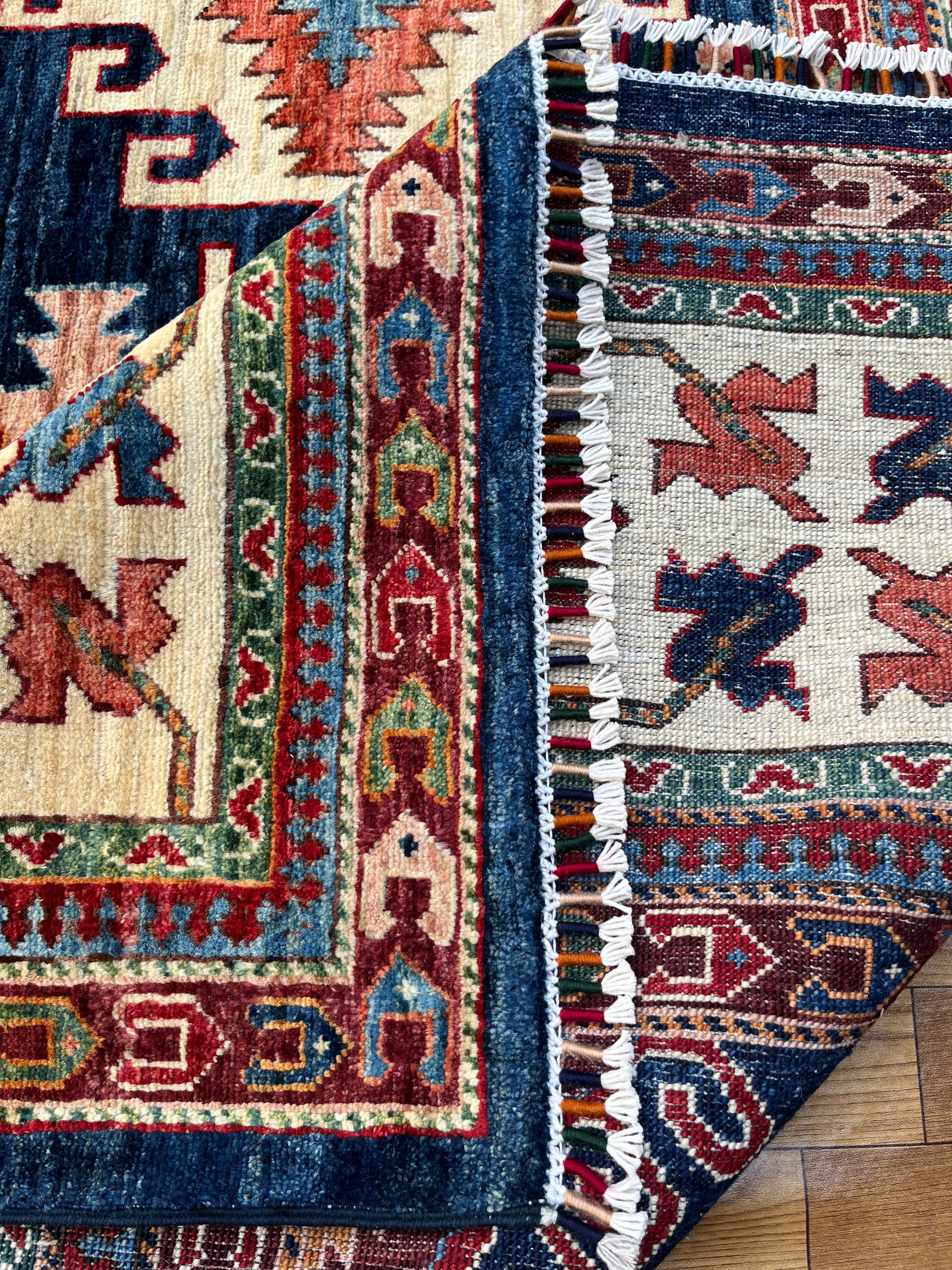 Close-up of Ghazni Rug, an authentic Afghan hand-woven wool rug with intricate traditional patterns, eco-friendly dyes, and artisan craftsmanship.