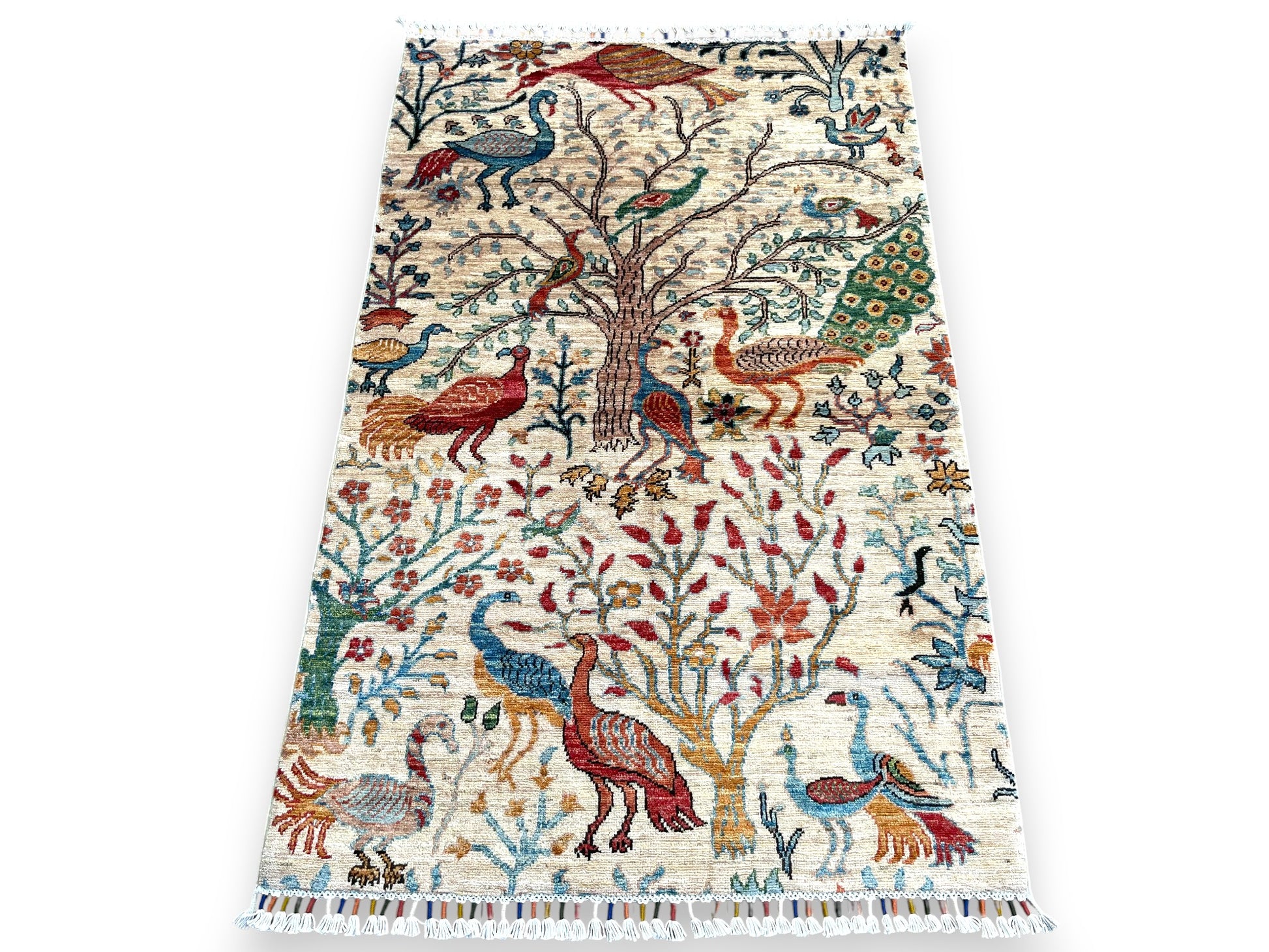 Hand-woven Jowzjan Afghan wool rug featuring intricate traditional patterns, crafted with natural dyes and 100% wool, displayed on a wooden floor room setting view