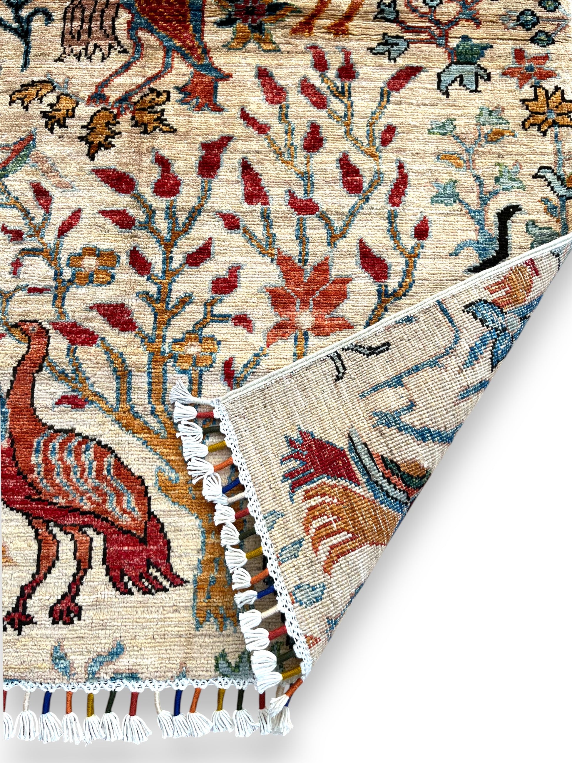Hand-woven Jowzjan Afghan wool rug featuring intricate traditional patterns, crafted with natural dyes and 100% wool, displayed on a wooden floor.