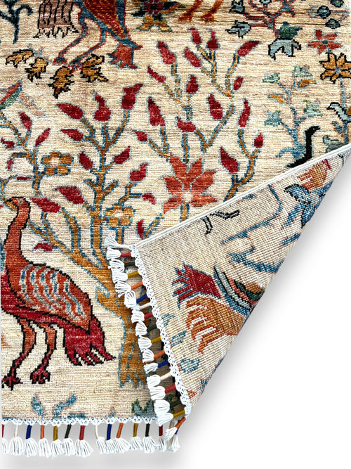 Hand-woven Jowzjan Afghan wool rug featuring intricate traditional patterns, crafted with natural dyes and 100% wool, displayed on a wooden floor.