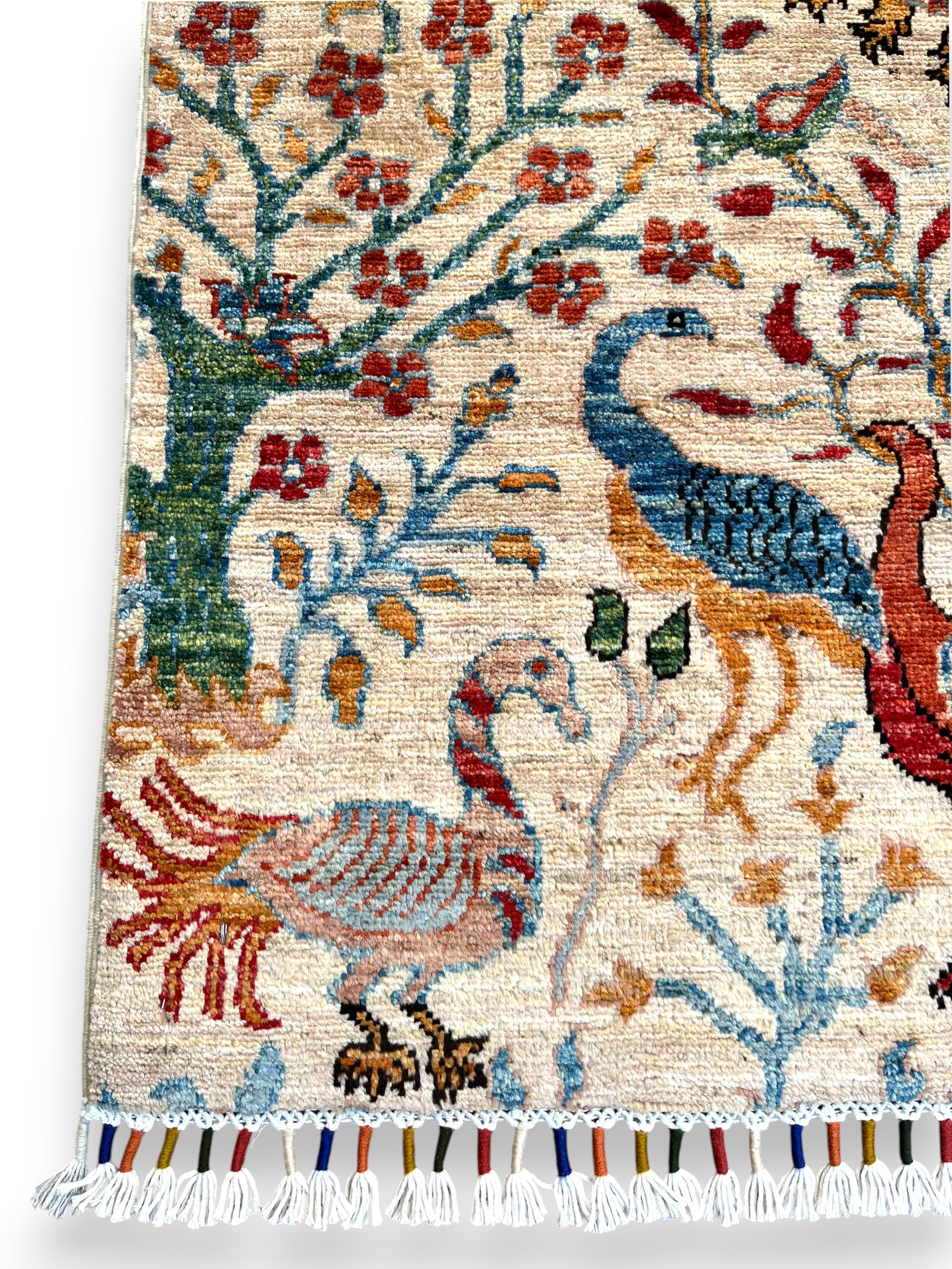 Hand-woven Jowzjan Afghan wool rug featuring intricate traditional patterns, crafted with natural dyes and 100% wool, displayed on a wooden floor.